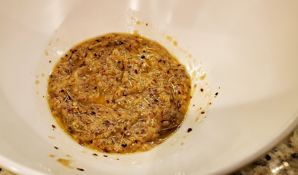 Mix olive oil, ginger paste, garlic paste, rosemary, oregano, red chili flakes and salt in a bowl and set aside